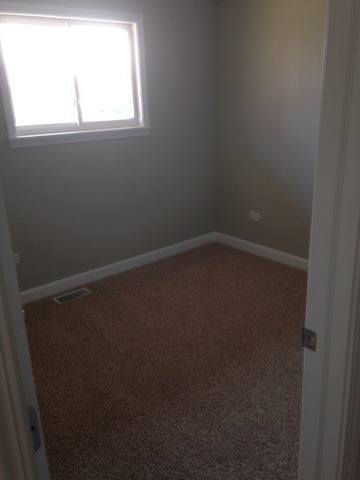 193 South Pinecrest Road Bolingbrook, IL 60440 - Photo 17 of 21 an empty room with a window
