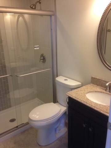 193 South Pinecrest Road Bolingbrook, IL 60440 - Photo 10 of 21 a white toilet sitting next to a bathroom sink