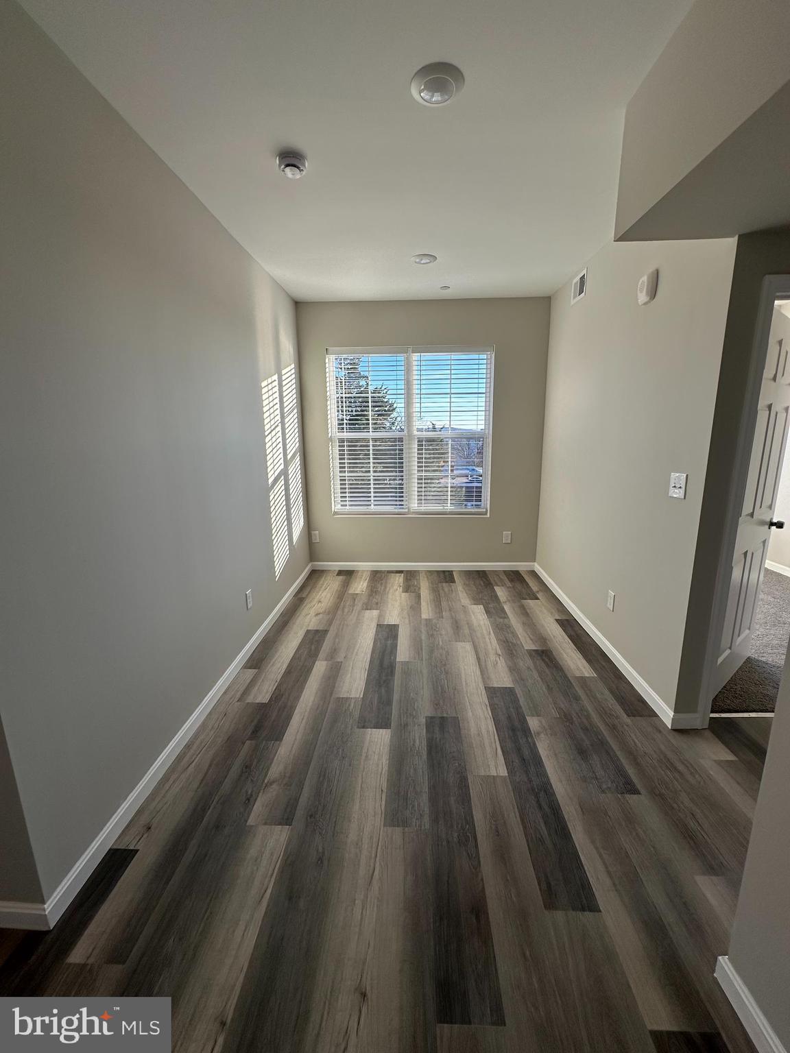 1812 H Place Northeast, Unit B02 Washington, DC 20002 - Photo 6 of 13 a view of wooden floor in a room