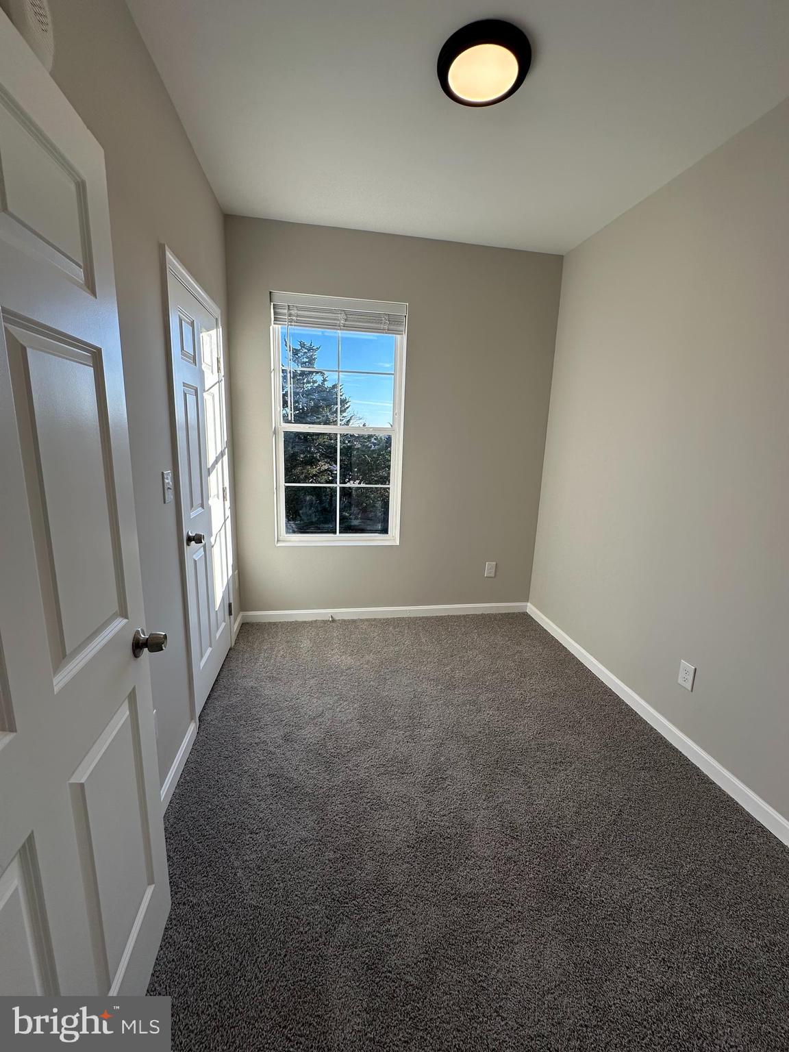 1812 H Place Northeast, Unit B02 Washington, DC 20002 - Photo 9 of 13 an empty room with windows