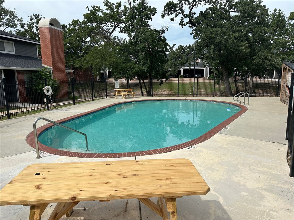 1501 Stallings Drive, Unit 52 College Station, TX 77840 - Photo 15 of 15 Community pool with a patio