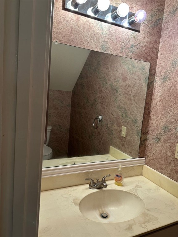 1501 Stallings Drive, Unit 52 College Station, TX 77840 - Photo 5 of 15 Bathroom featuring vanity and vaulted ceiling