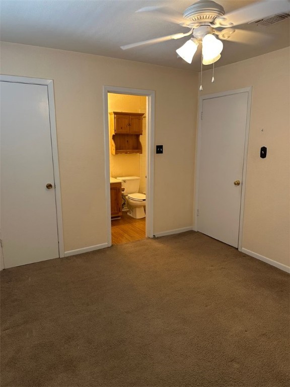 1501 Stallings Drive, Unit 52 College Station, TX 77840 - Photo 10 of 15 Unfurnished bedroom with light carpet, ceiling fan, and ensuite bathroom