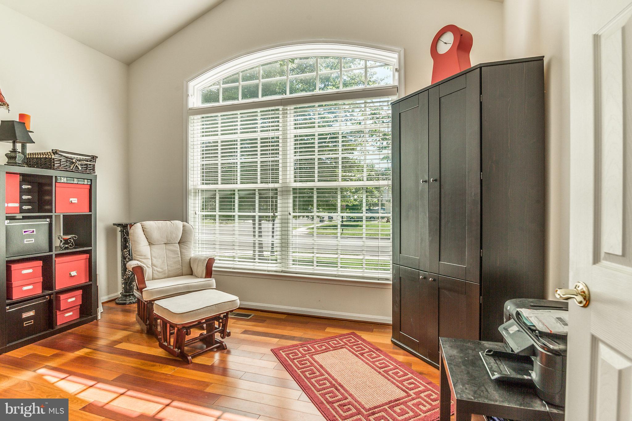 24806 Prairie Grass Drive Aldie, VA 20105 - Photo 14 of 30 a living room with furniture a rug and a window