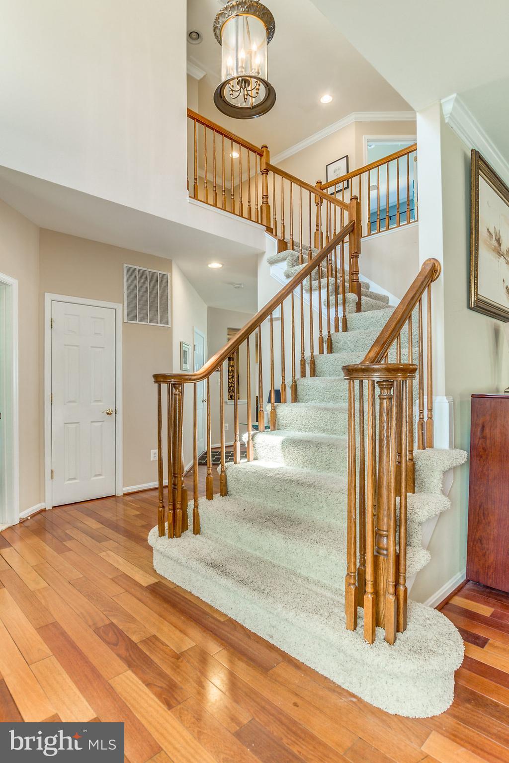 24806 Prairie Grass Drive Aldie, VA 20105 - Photo 3 of 30 a view of entryway and hall with wooden floor