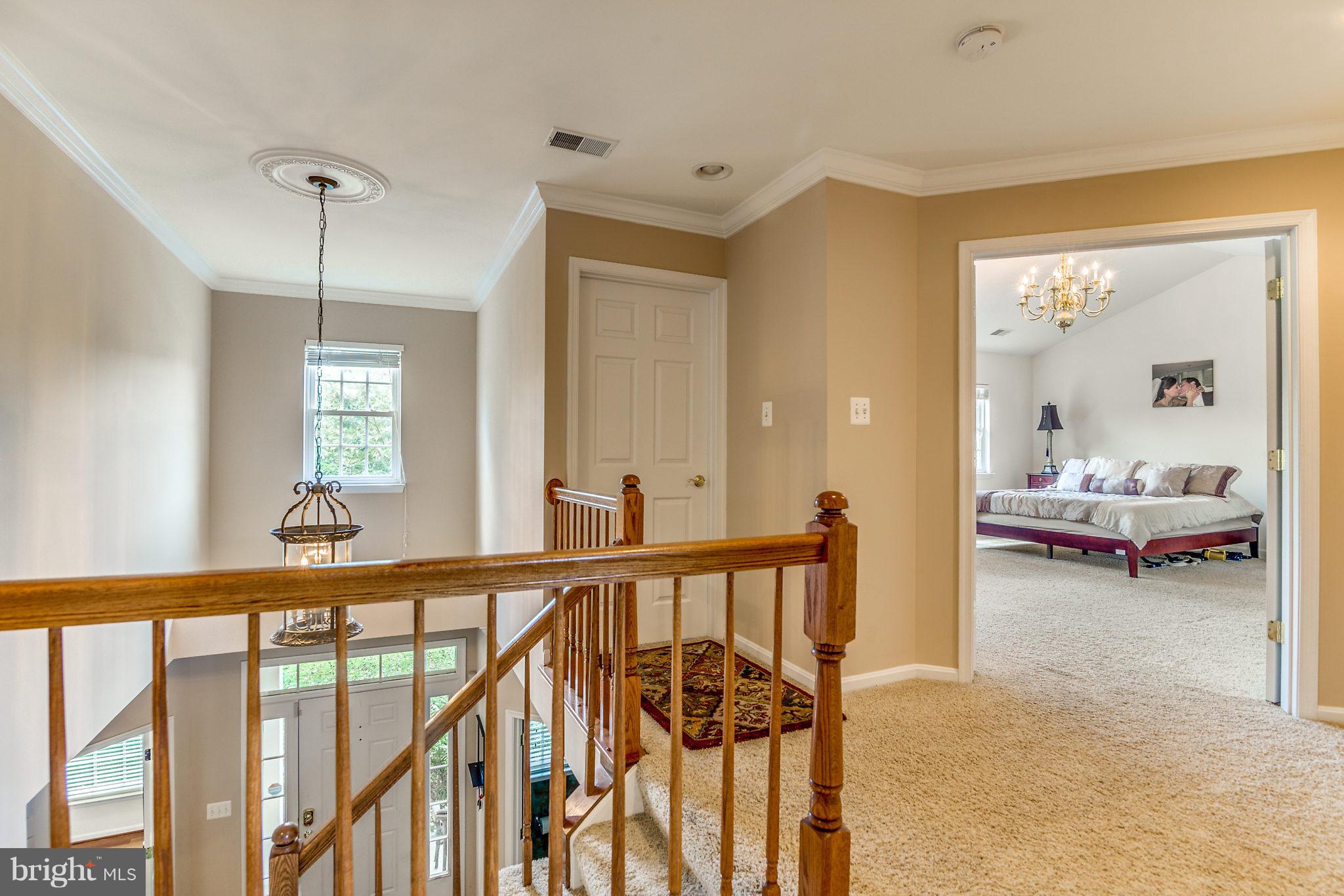 24806 Prairie Grass Drive Aldie, VA 20105 - Photo 23 of 30 a view of a room with lots of furniture and windows