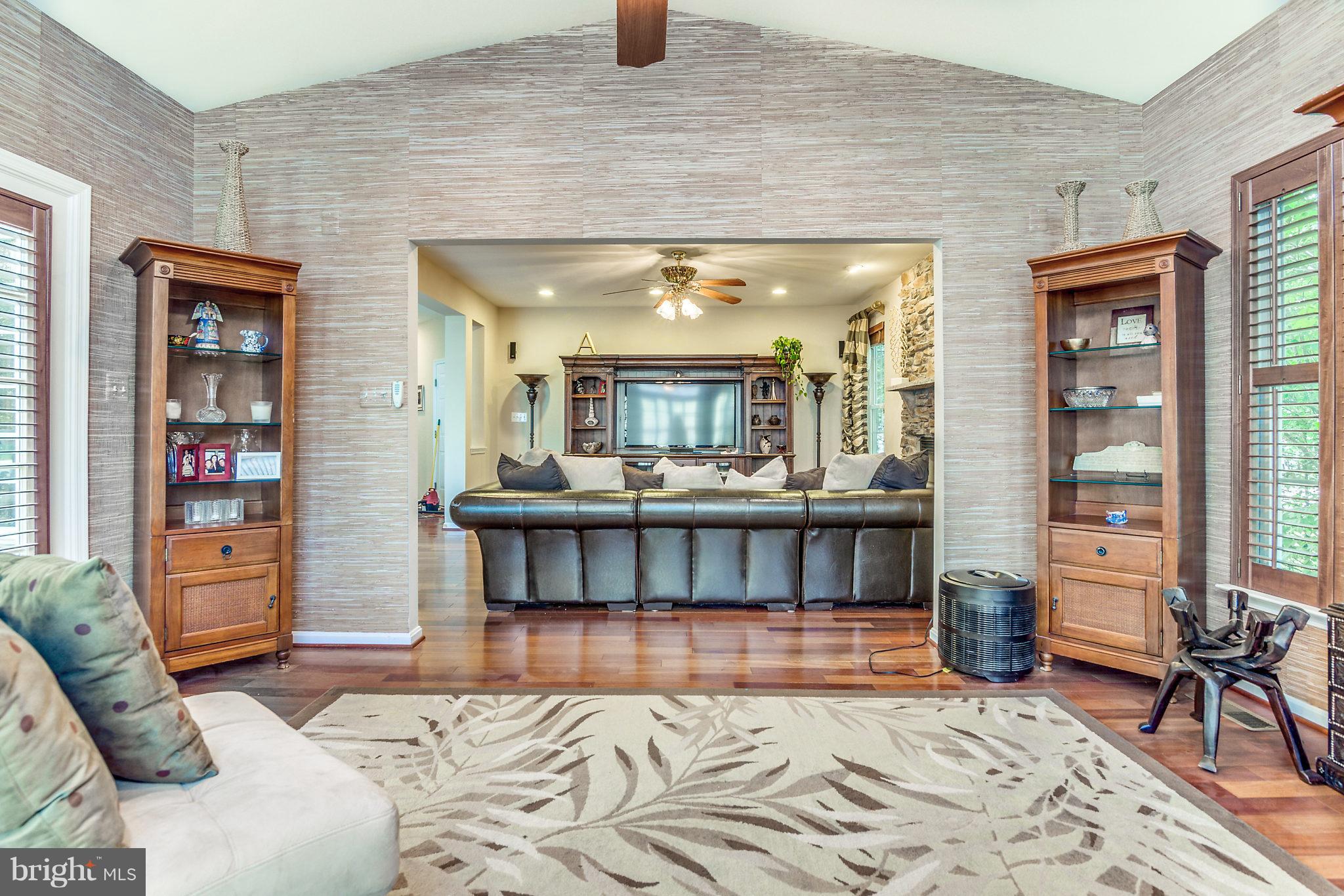 24806 Prairie Grass Drive Aldie, VA 20105 - Photo 6 of 30 a bedroom with furniture and a book shelf