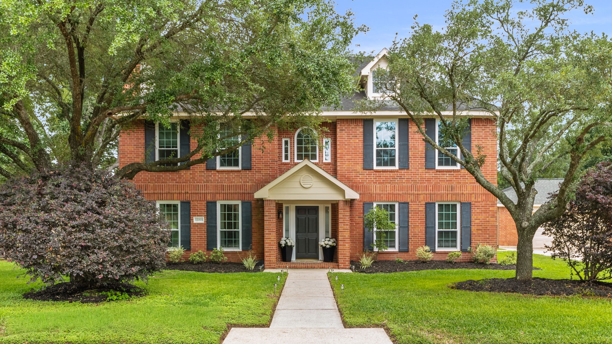 Charming two-story in the gated community of Decker Oaks.