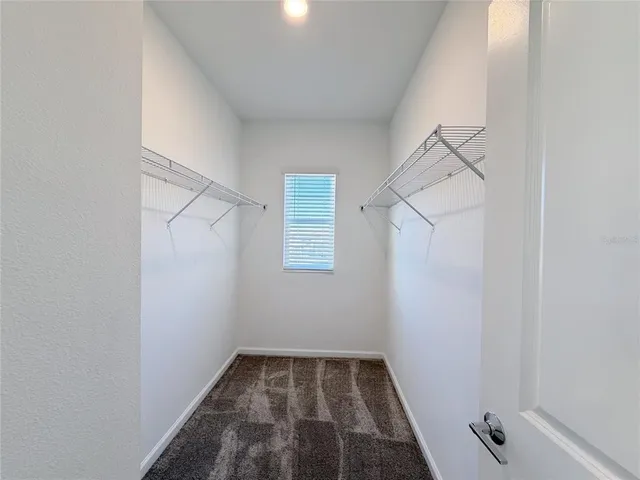 a bathroom with a granite countertop sink and shower