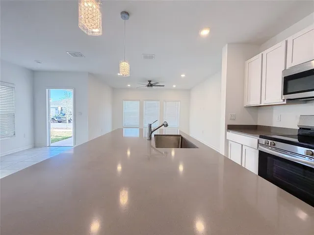 a view of a swimming pool and outdoor seating