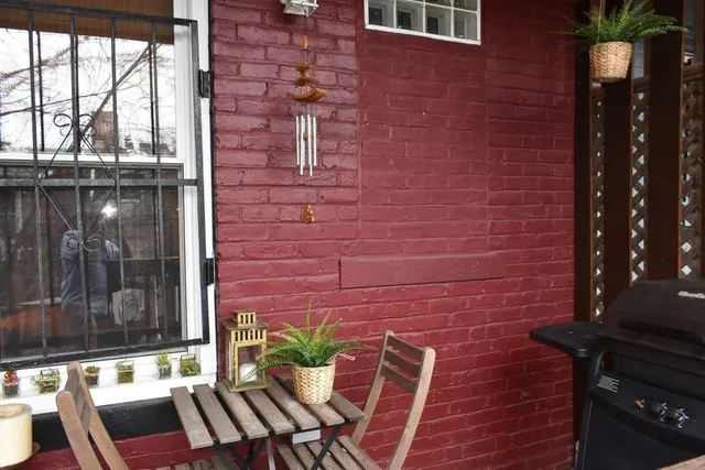a brick building with a glass door