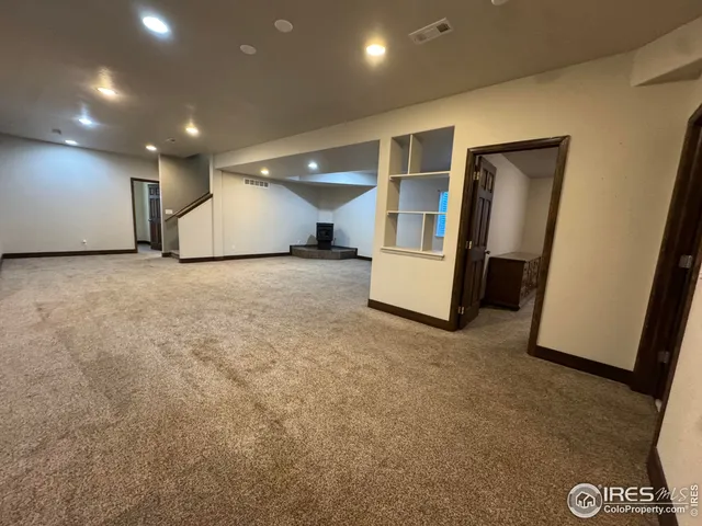 a view of a hallway with stairs