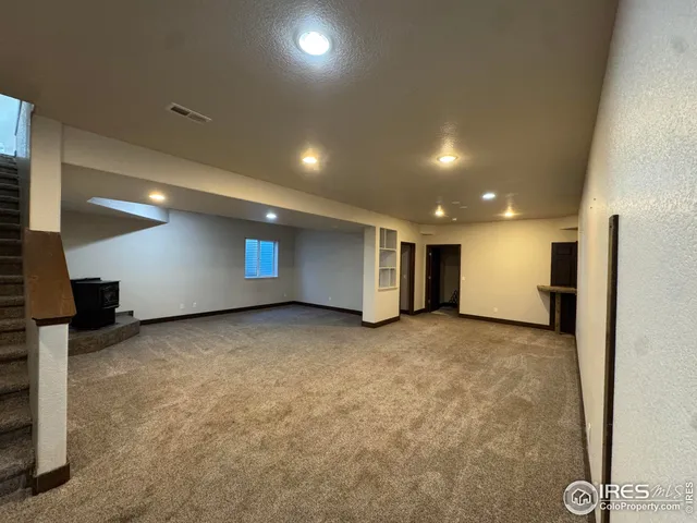a view of a hallway with seating area