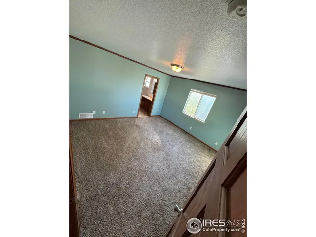 a view of a hallway with staircase