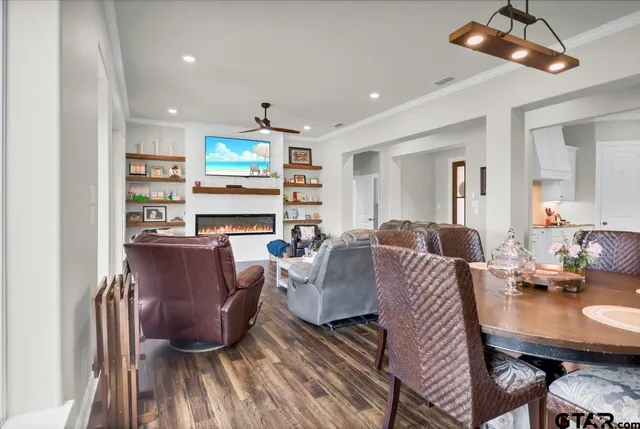 a living room with furniture or couch and a chandelier