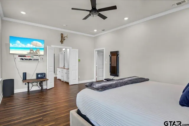 a bedroom with a bed and a desk