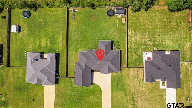 a view of yard with swimming pool and green space
