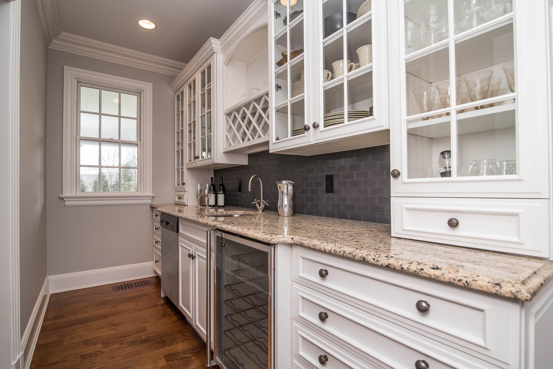38 Pembroke Road Darien, CT 06820 - Photo 15 of 41 a kitchen with stainless steel appliances granite countertop a sink and cabinets