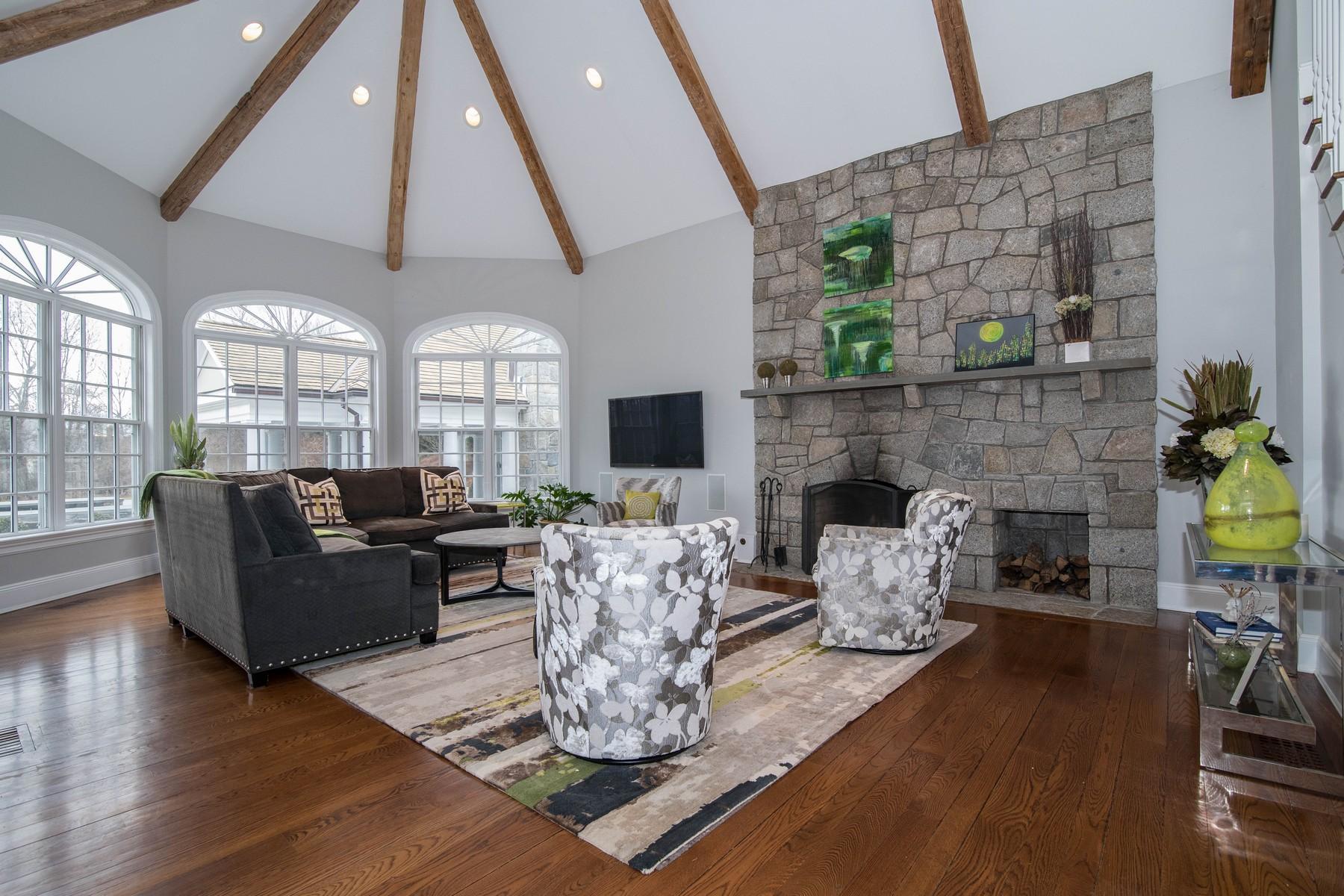 38 Pembroke Road Darien, CT 06820 - Photo 16 of 41 a living room with furniture fireplace and flat screen tv