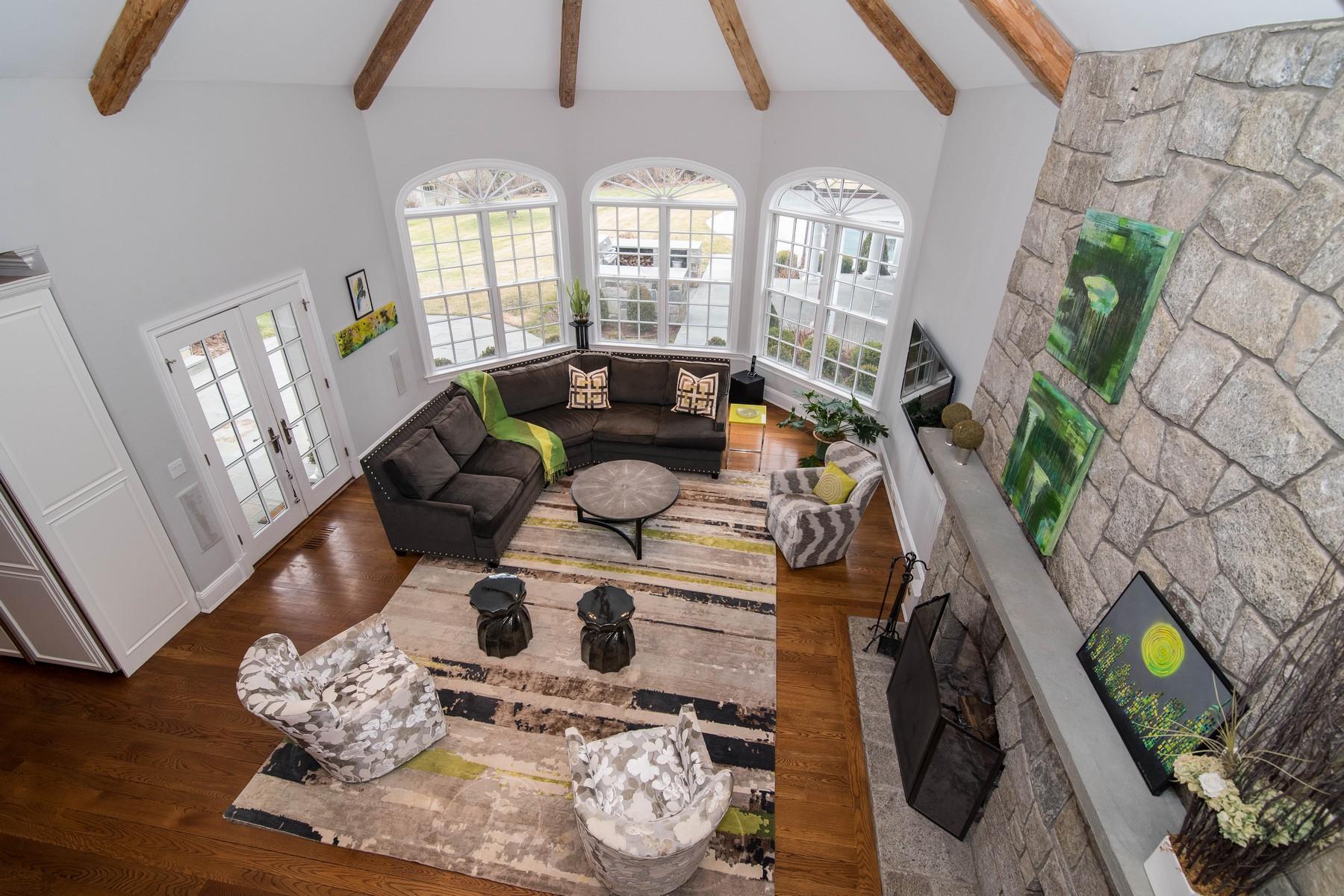 38 Pembroke Road Darien, CT 06820 - Photo 17 of 41 a living room with furniture fireplace and wooden floor