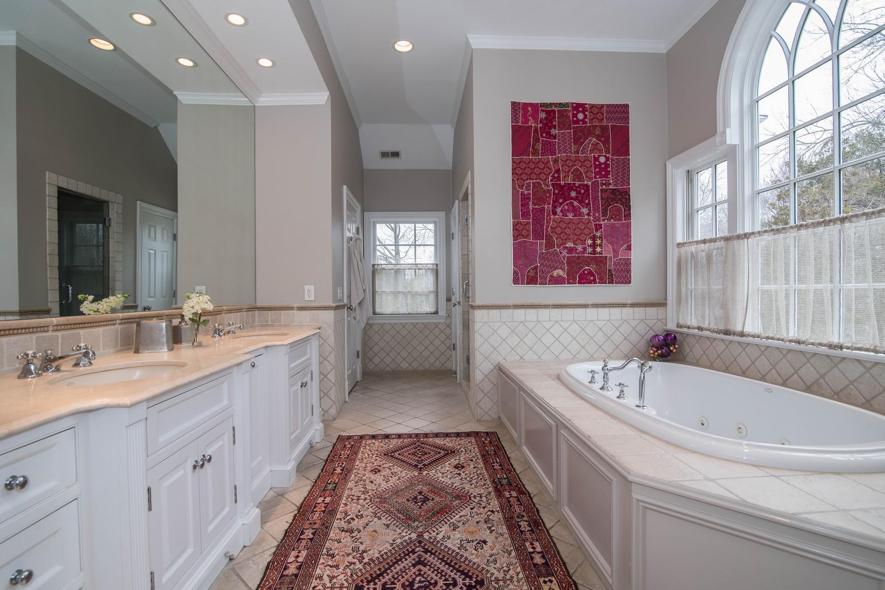 38 Pembroke Road Darien, CT 06820 - Photo 20 of 41 a spacious bathroom with a granite countertop tub sink and mirror