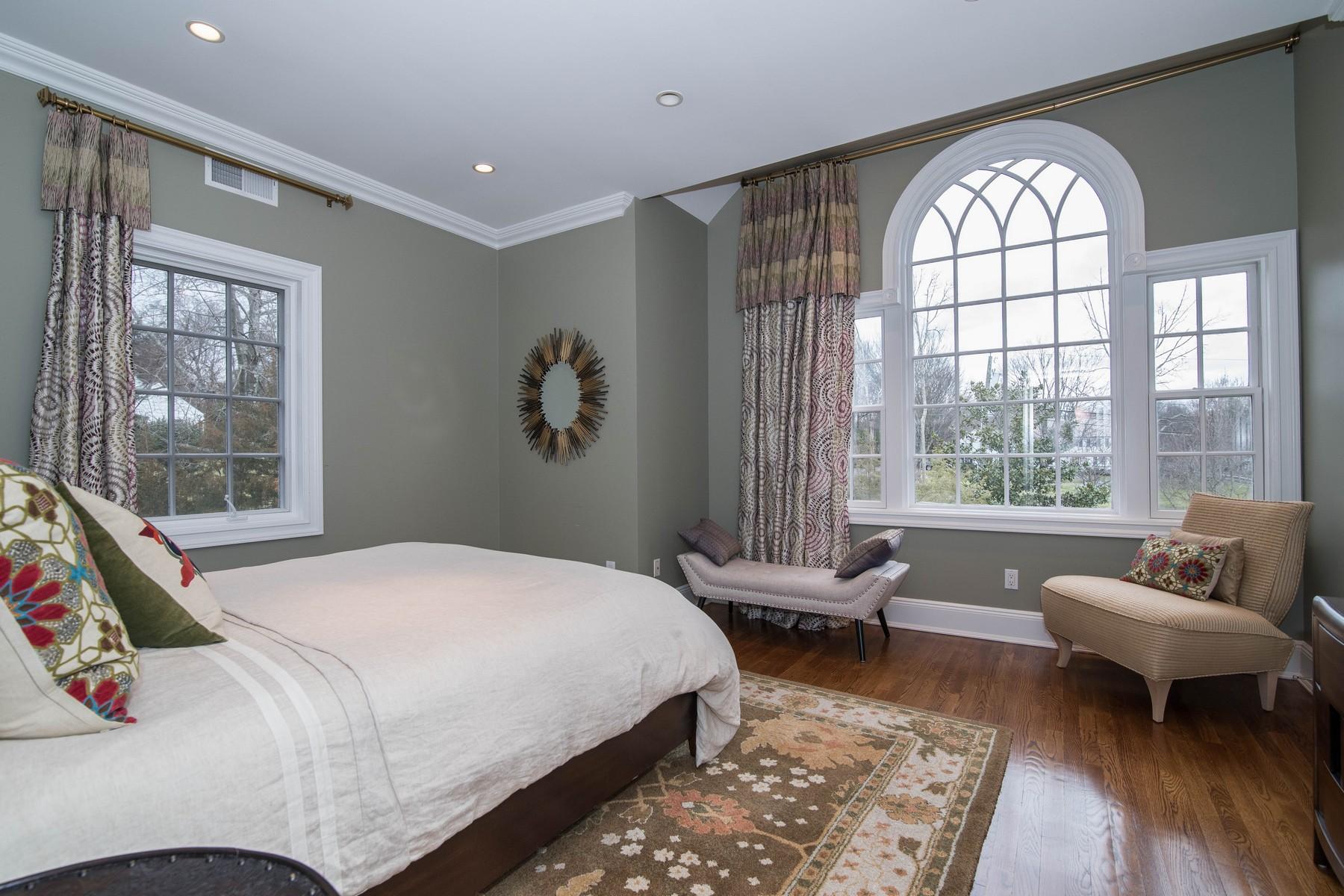 38 Pembroke Road Darien, CT 06820 - Photo 22 of 41 a bedroom with a bed and glass window