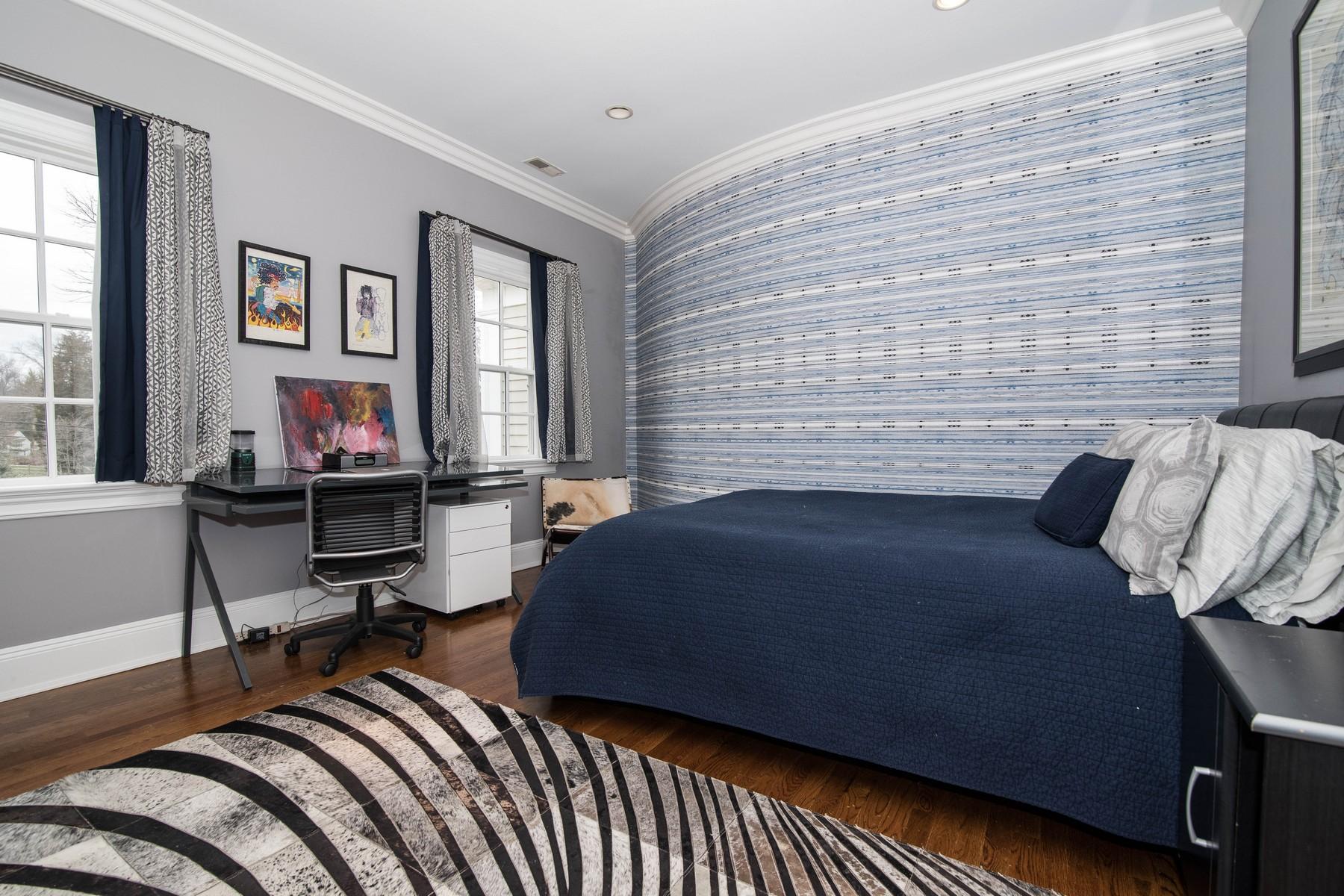 38 Pembroke Road Darien, CT 06820 - Photo 23 of 41 a bedroom with a bed and wooden floor