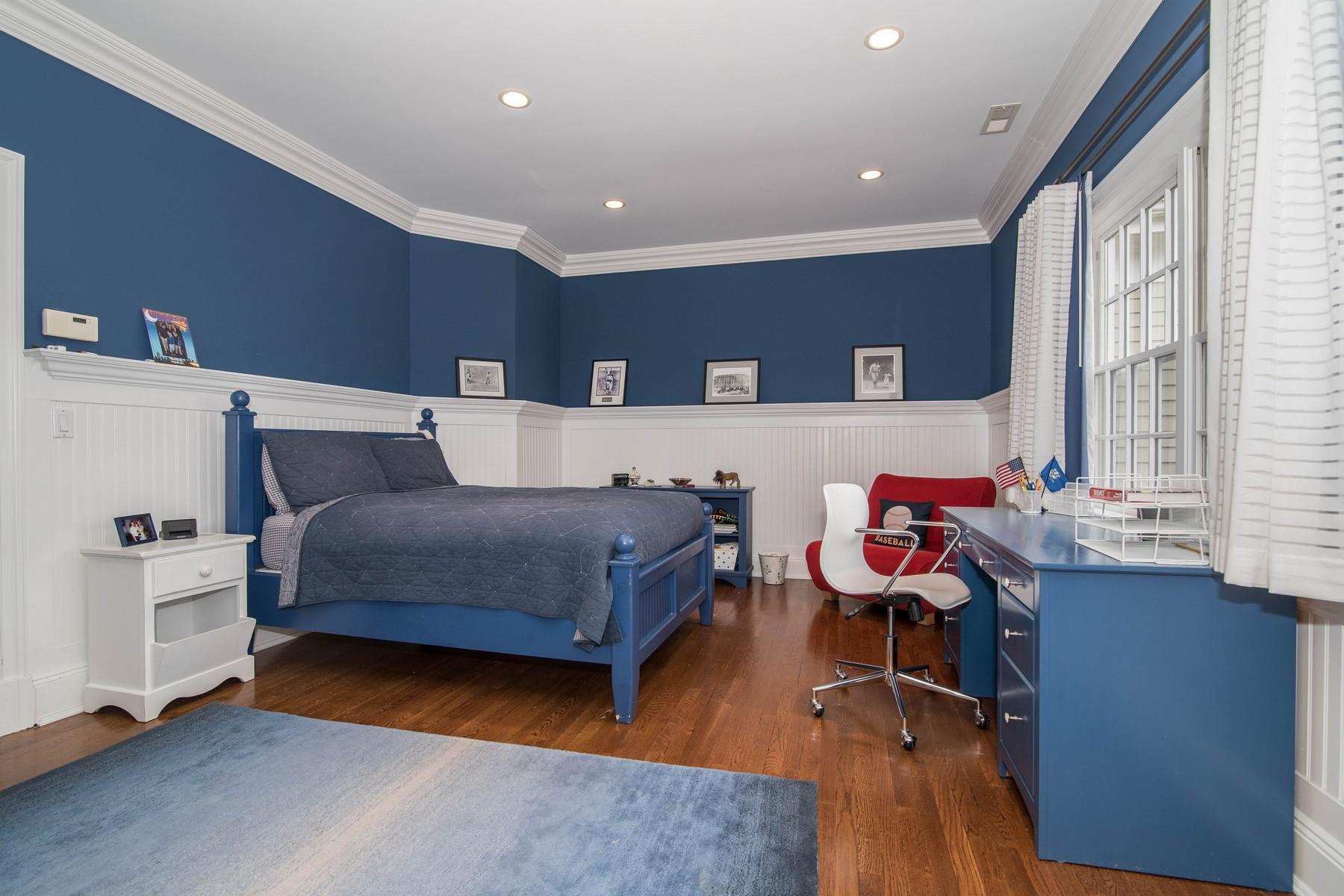 38 Pembroke Road Darien, CT 06820 - Photo 24 of 41 a bedroom with a bed and a desk in it