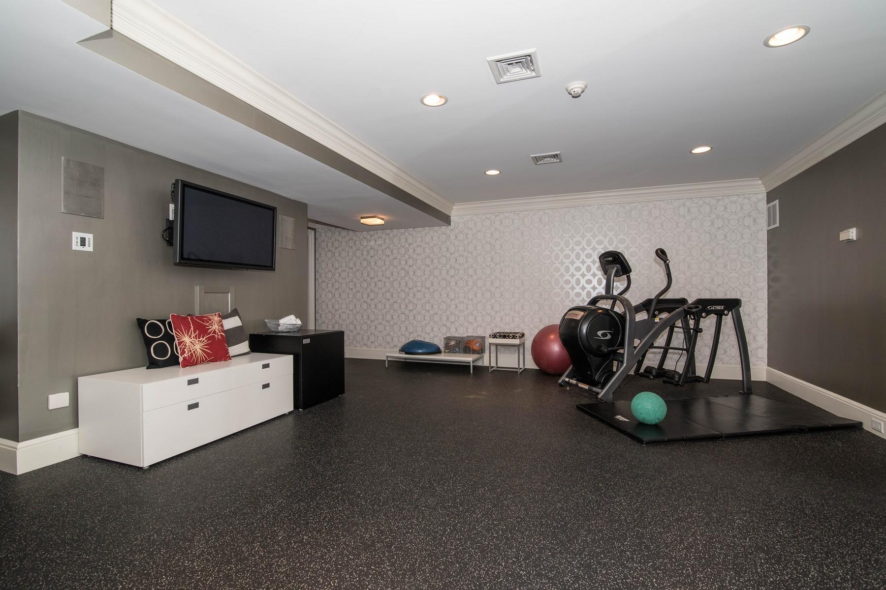 38 Pembroke Road Darien, CT 06820 - Photo 26 of 41 a room with furniture and a flat screen tv