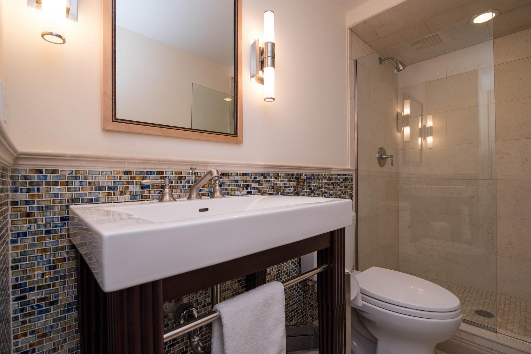 38 Pembroke Road Darien, CT 06820 - Photo 28 of 41 a bathroom with a sink a toilet and shower