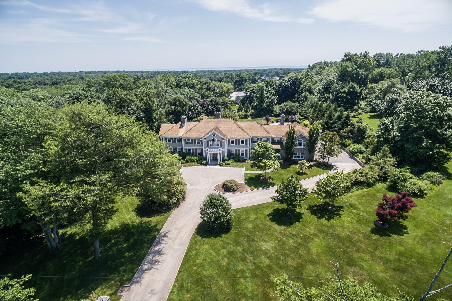 38 Pembroke Road Darien, CT 06820 - Photo 3 of 41 a view of a house with a yard and potted plants