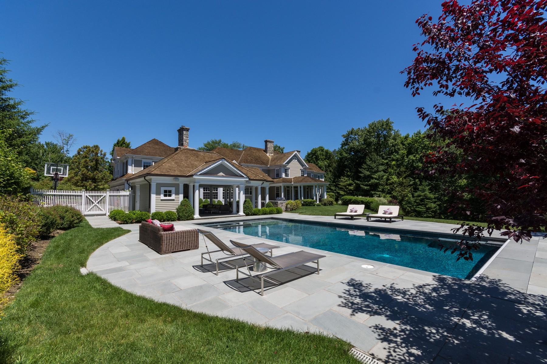38 Pembroke Road Darien, CT 06820 - Photo 31 of 41 a front view of a house with swimming pool having outdoor seating