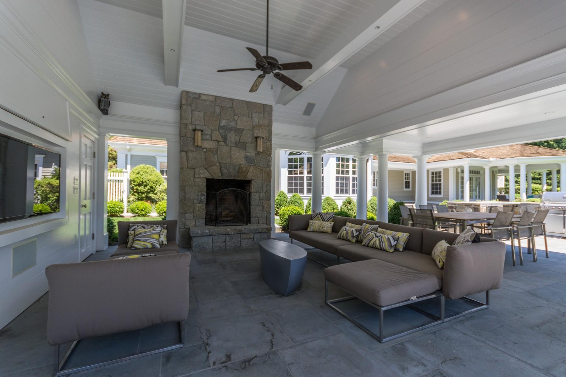 38 Pembroke Road Darien, CT 06820 - Photo 33 of 41 a living room with furniture and a fireplace