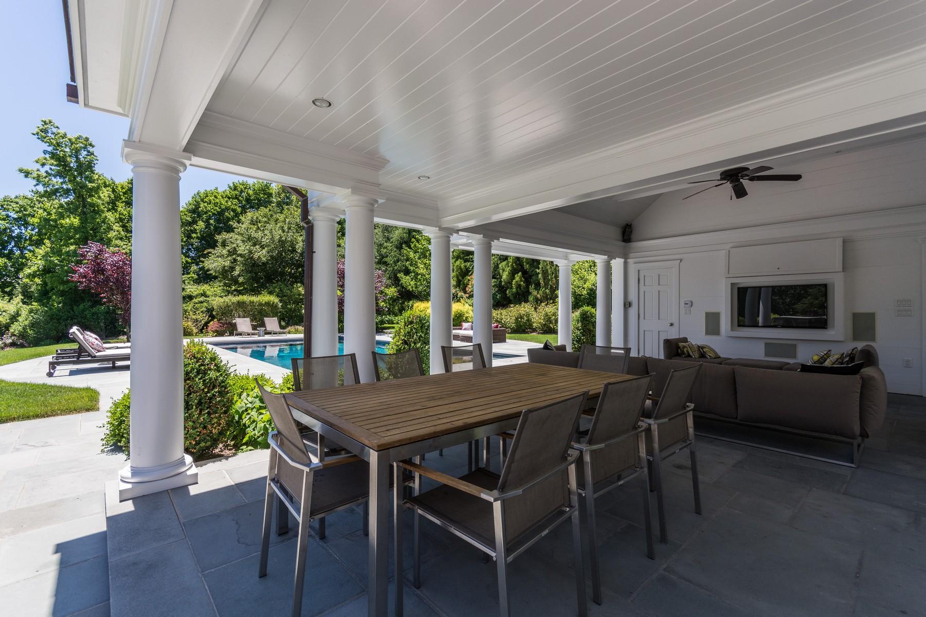 38 Pembroke Road Darien, CT 06820 - Photo 34 of 41 a view of a dining table and chairs in patio