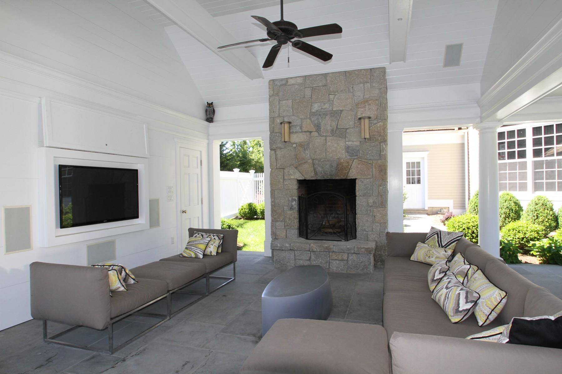38 Pembroke Road Darien, CT 06820 - Photo 35 of 41 a living room with furniture and a flat screen tv