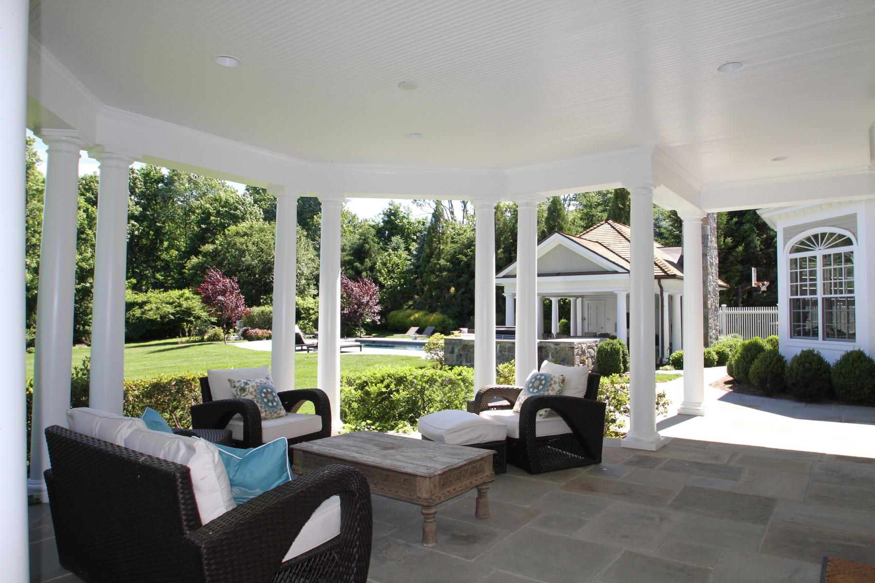 38 Pembroke Road Darien, CT 06820 - Photo 37 of 41 a front view of a house with garden and patio