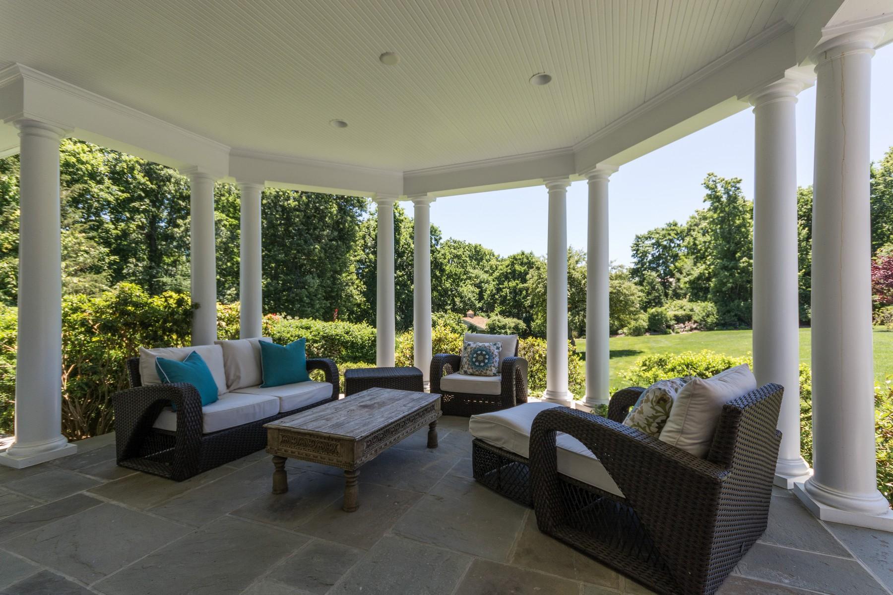 38 Pembroke Road Darien, CT 06820 - Photo 38 of 41 a living room with furniture and a large window