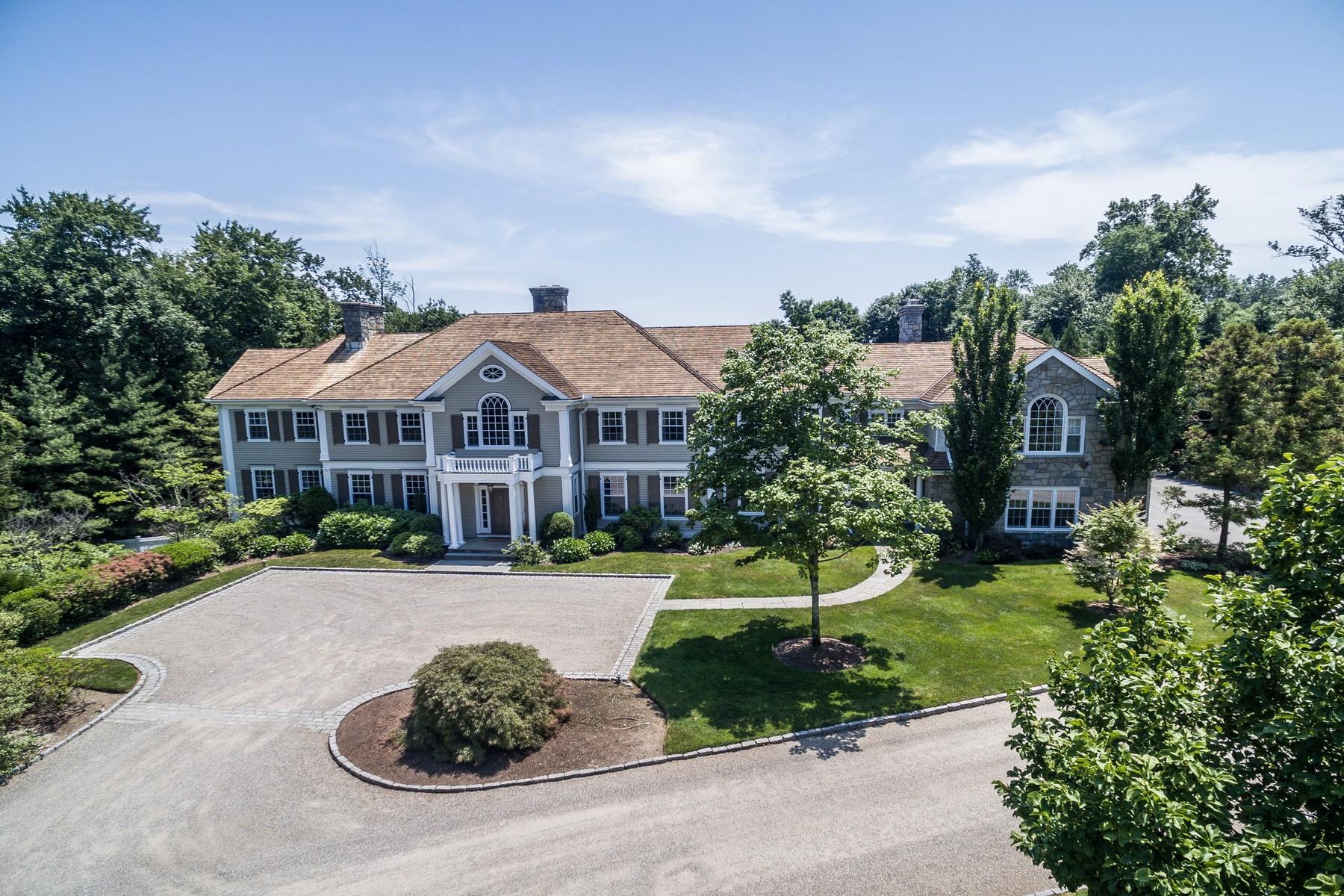 38 Pembroke Road Darien, CT 06820 - Photo 4 of 41 a front view of a house with a yard and garage