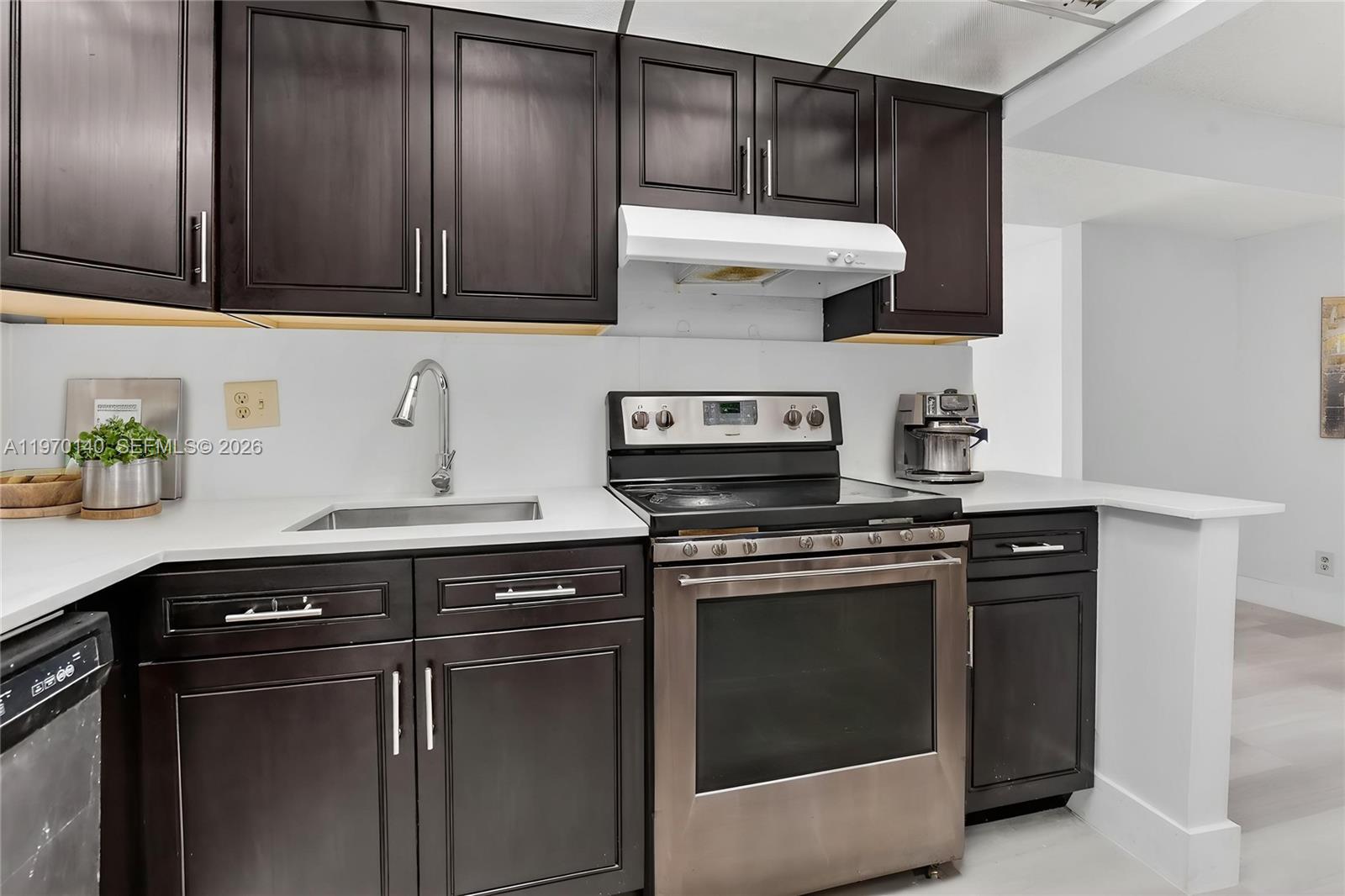 450 Northwest 20th Street, Unit 2120 Boca Raton, FL 33431 - Photo 11 of 27 a kitchen with stainless steel appliances granite countertop a stove and a sink
