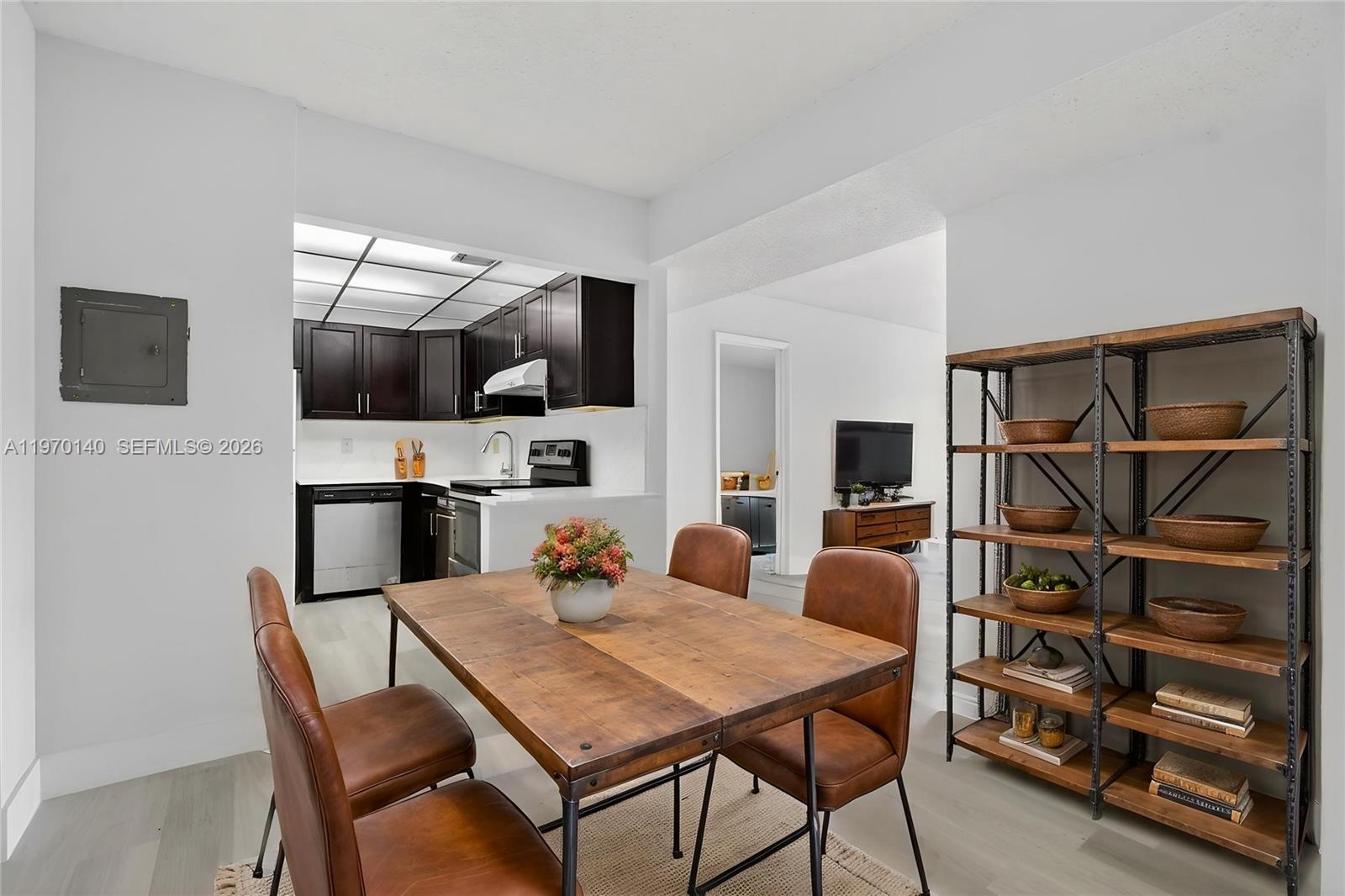 450 Northwest 20th Street, Unit 2120 Boca Raton, FL 33431 - Photo 12 of 27 a view of a dining room with furniture and wooden floor