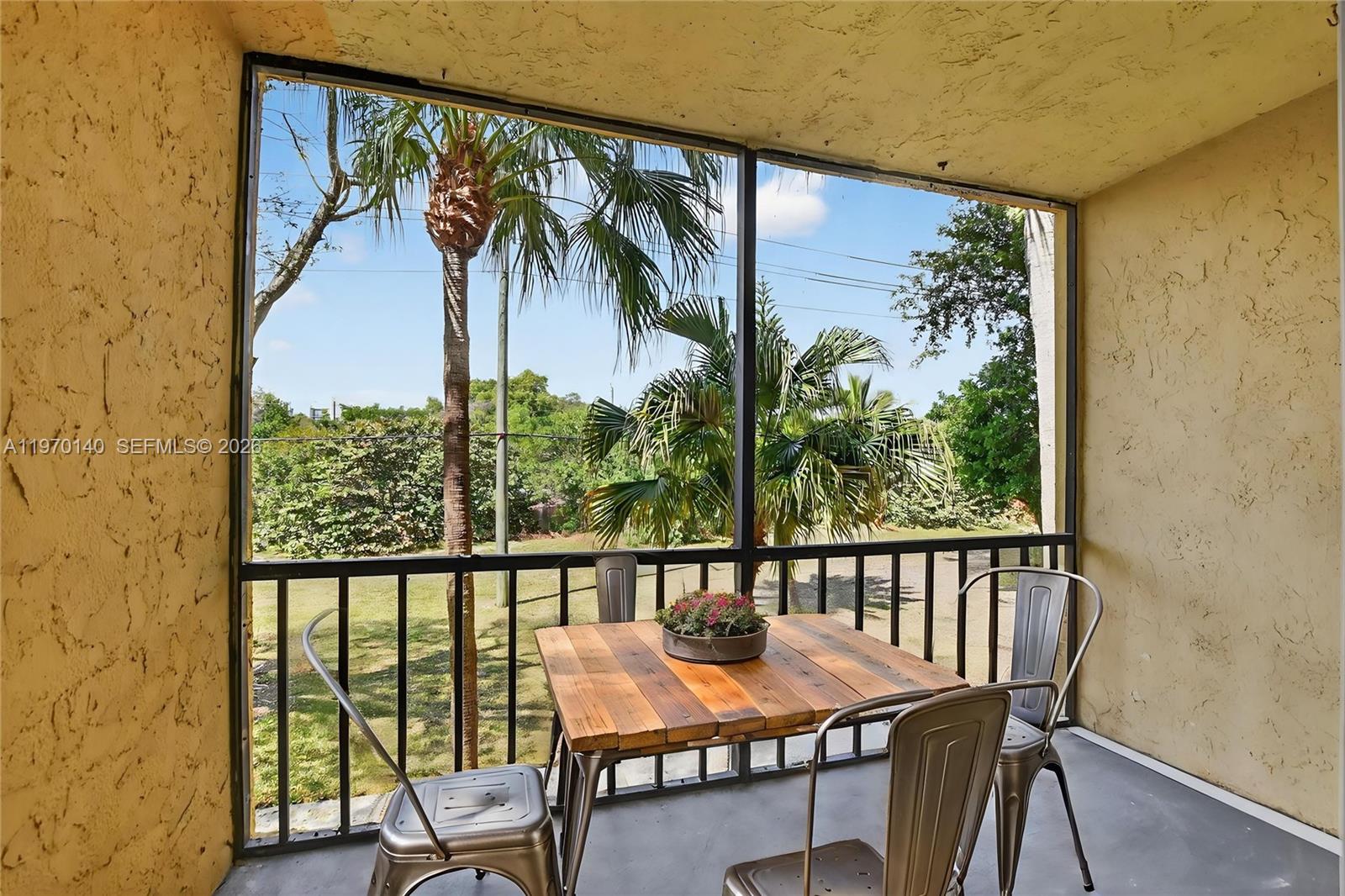 450 Northwest 20th Street, Unit 2120 Boca Raton, FL 33431 - Photo 20 of 27 a view of a balcony with furniture and a potted plant