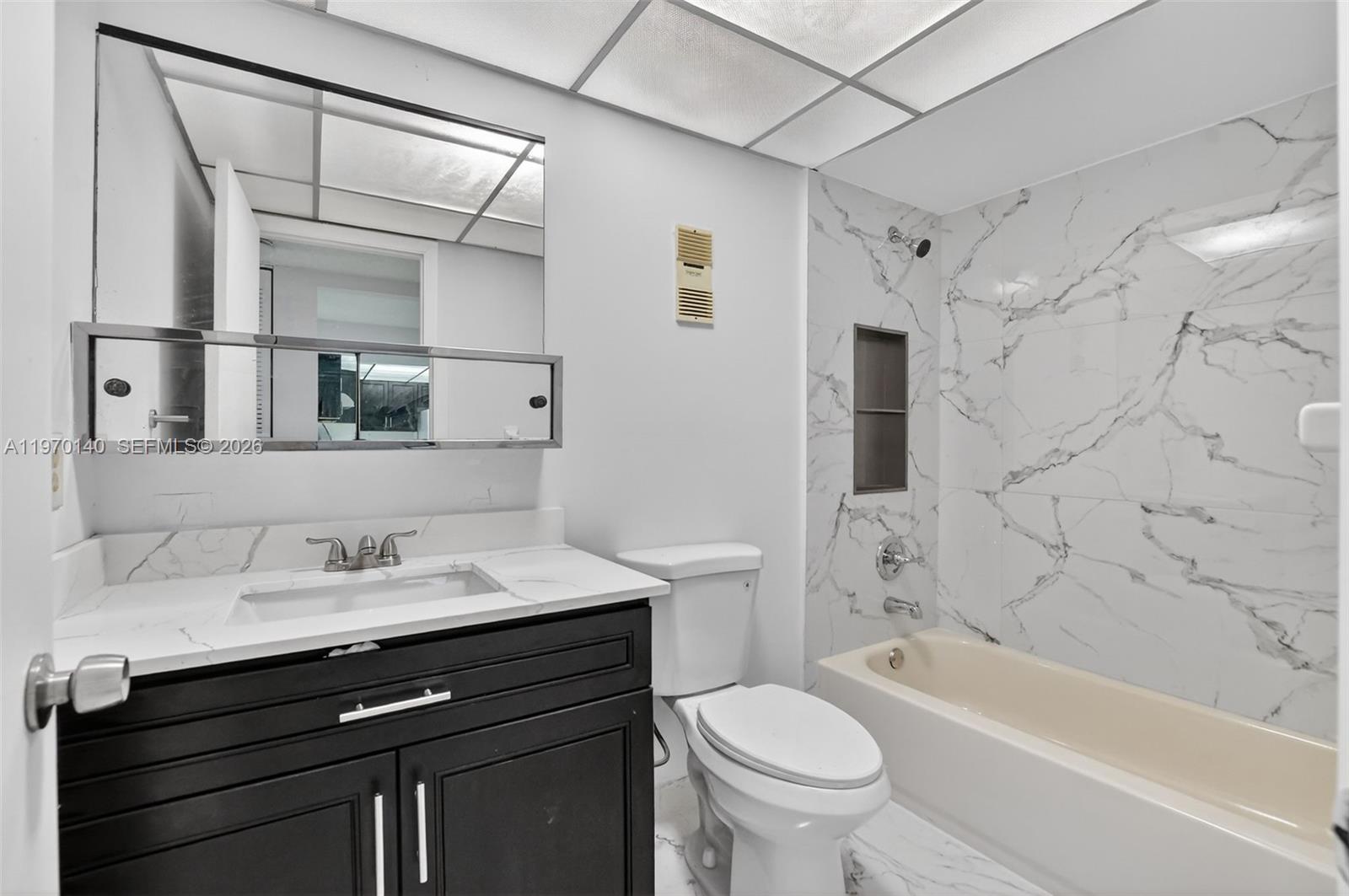 450 Northwest 20th Street, Unit 2120 Boca Raton, FL 33431 - Photo 4 of 27 a bathroom with a sink a toilet and shower