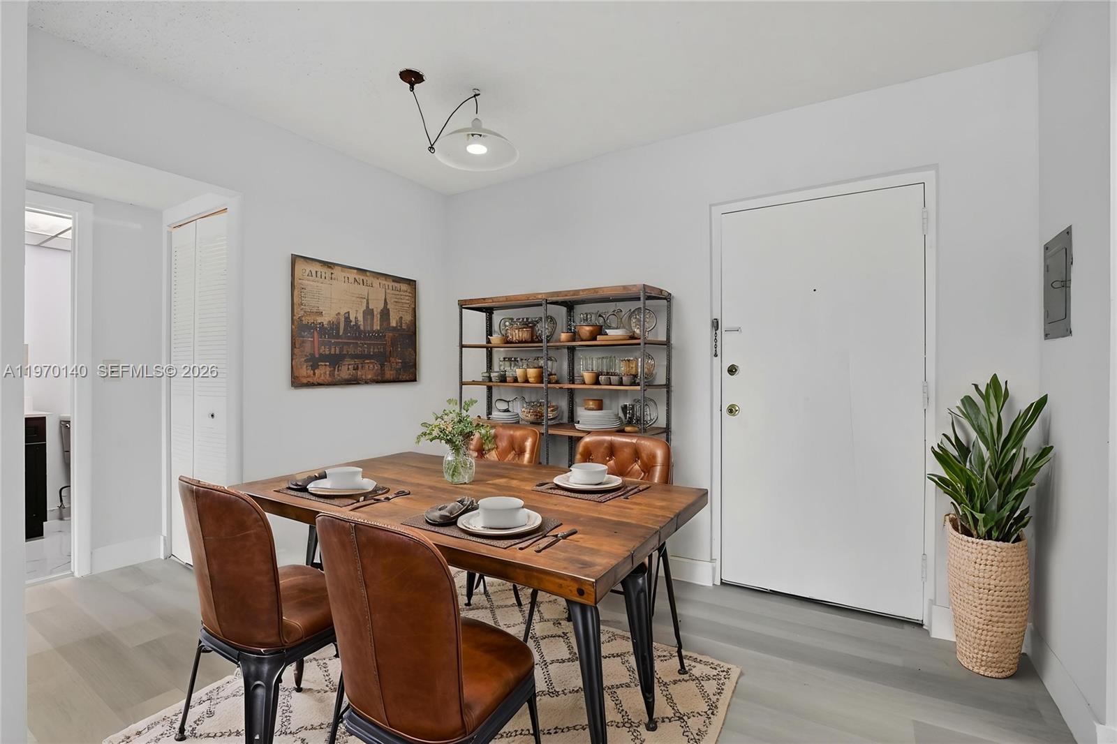 450 Northwest 20th Street, Unit 2120 Boca Raton, FL 33431 - Photo 6 of 27 a view of a dining room with furniture window and wooden floor
