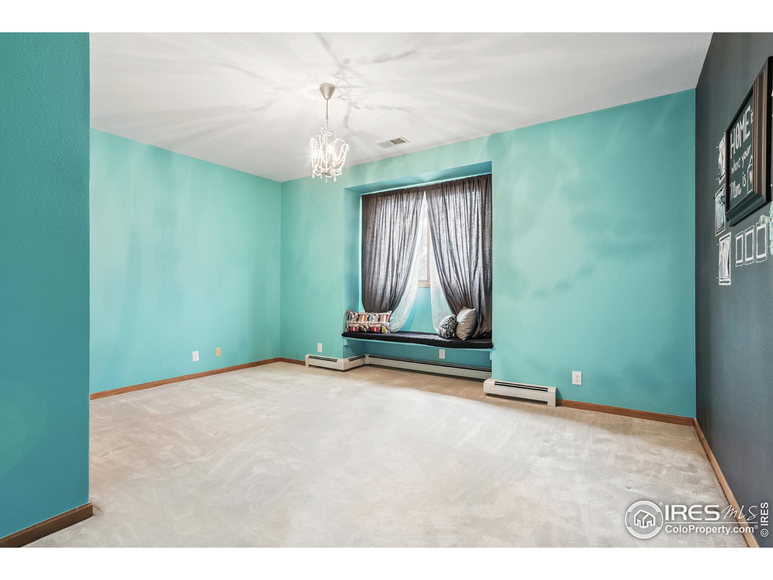 3310 Routt Street Wheat Ridge, CO 80033 - Photo 19 of 35 a view of an empty room with a fireplace
