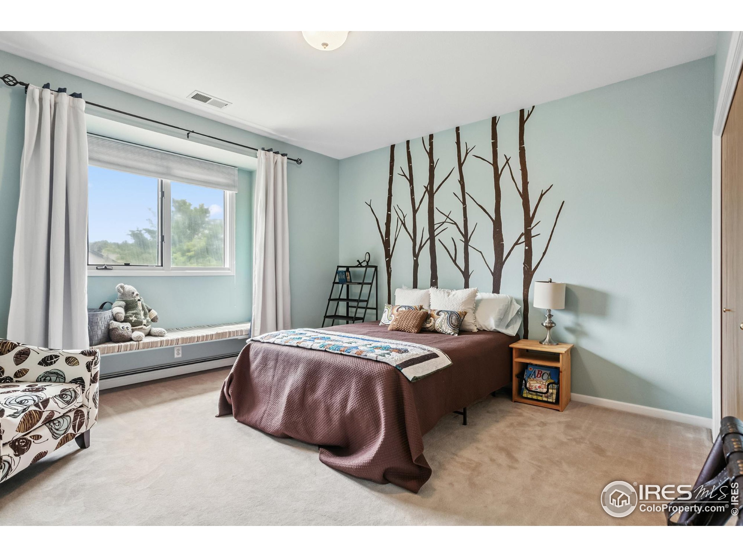 3310 Routt Street Wheat Ridge, CO 80033 - Photo 21 of 35 a bedroom with a bed and a window
