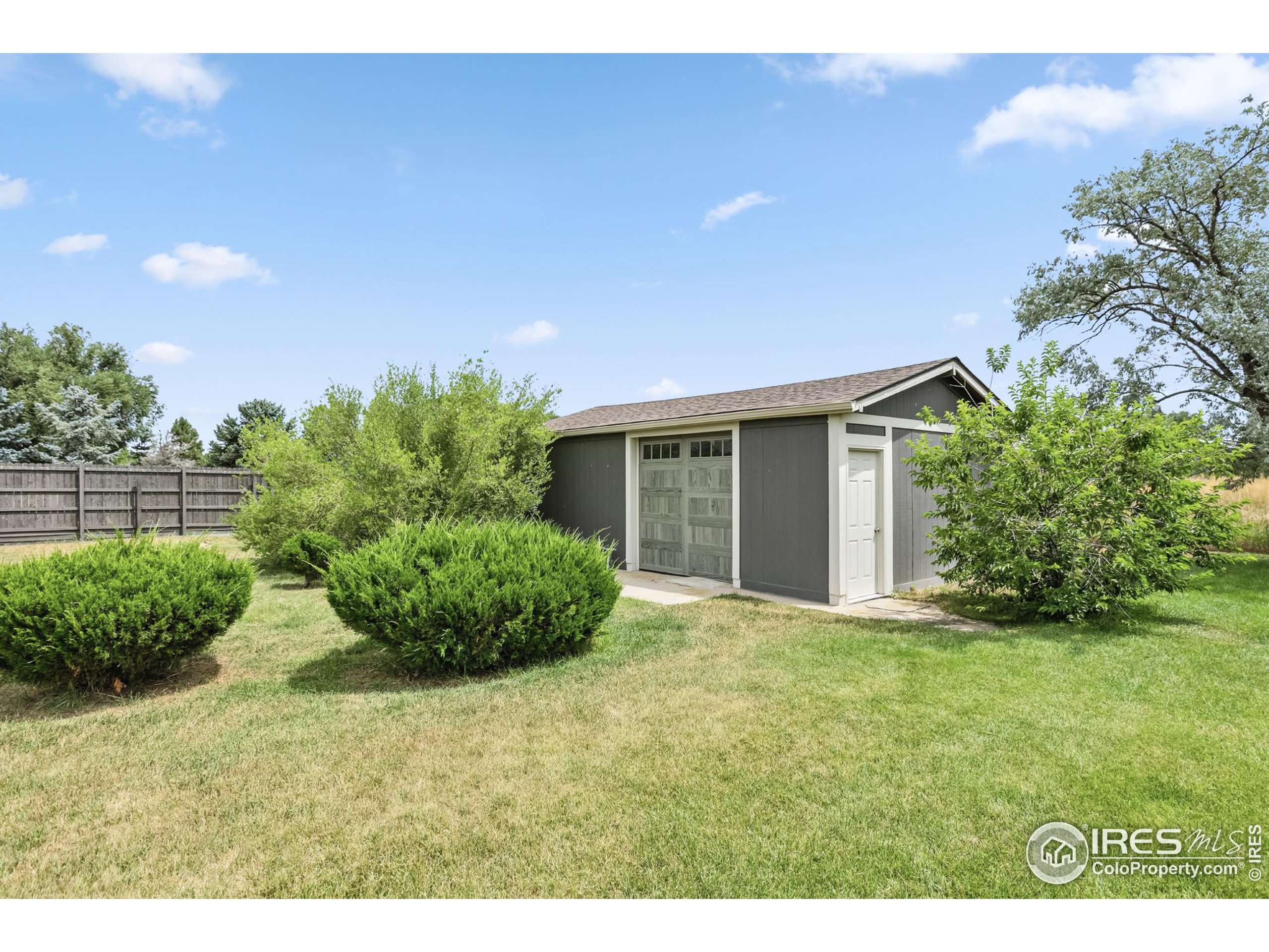 3310 Routt Street Wheat Ridge, CO 80033 - Photo 34 of 35 a view of an house with backyard space and garden