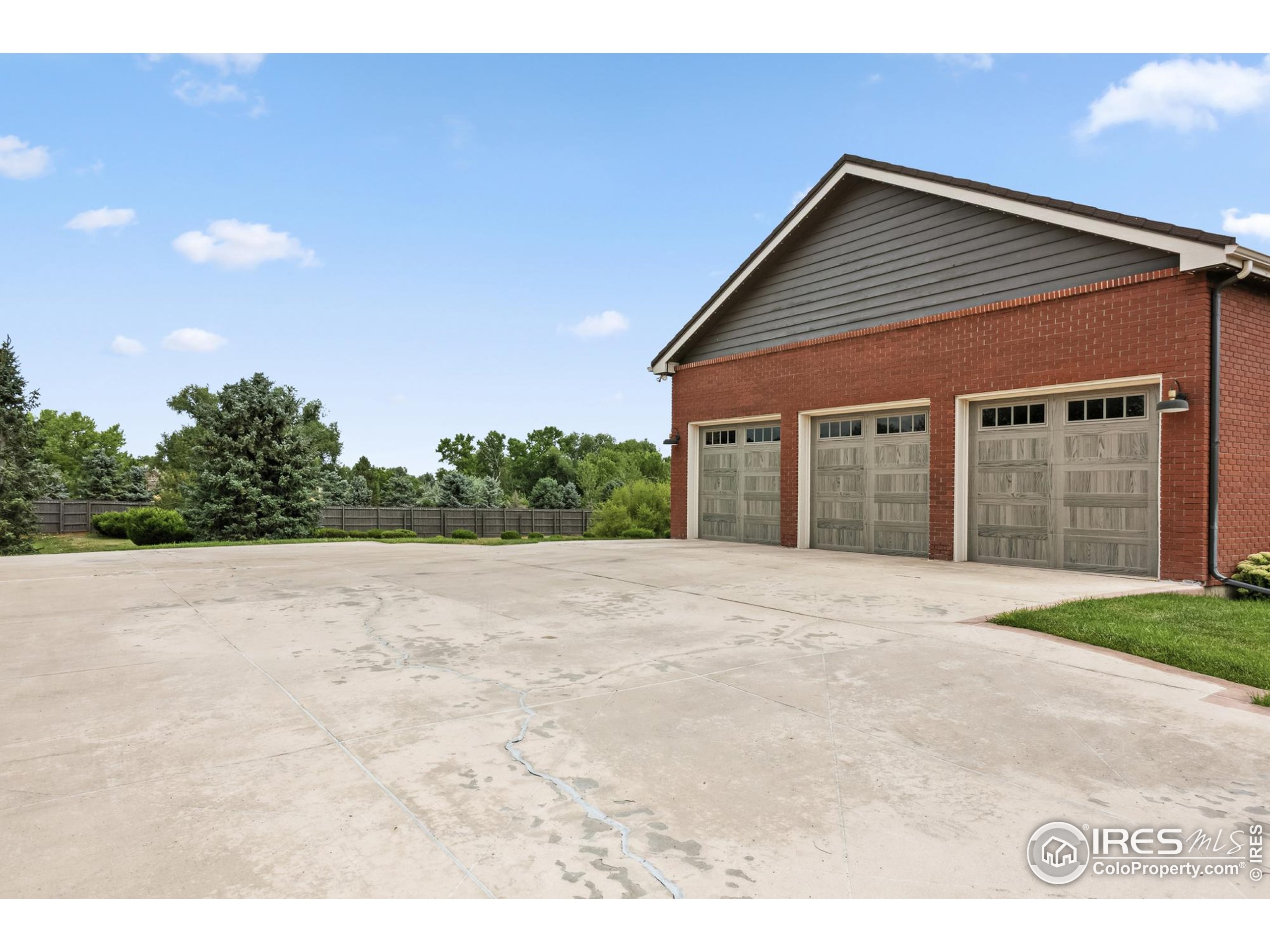 3310 Routt Street Wheat Ridge, CO 80033 - Photo 35 of 35 a front view of a house with a yard and garage