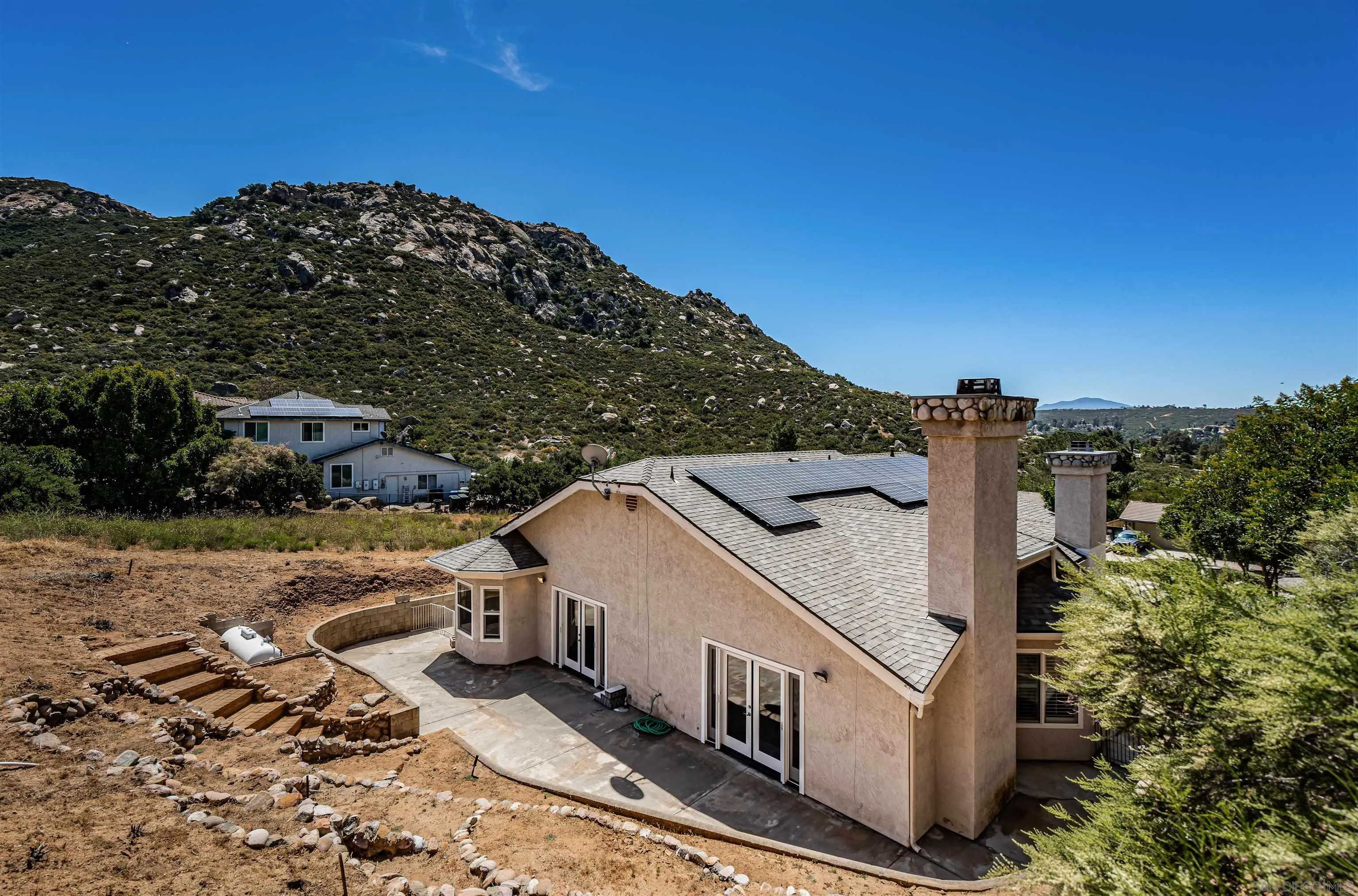 16754 Georgios Way Ramona, CA 92065 - Photo 20 of 29 a view of a house with a yard