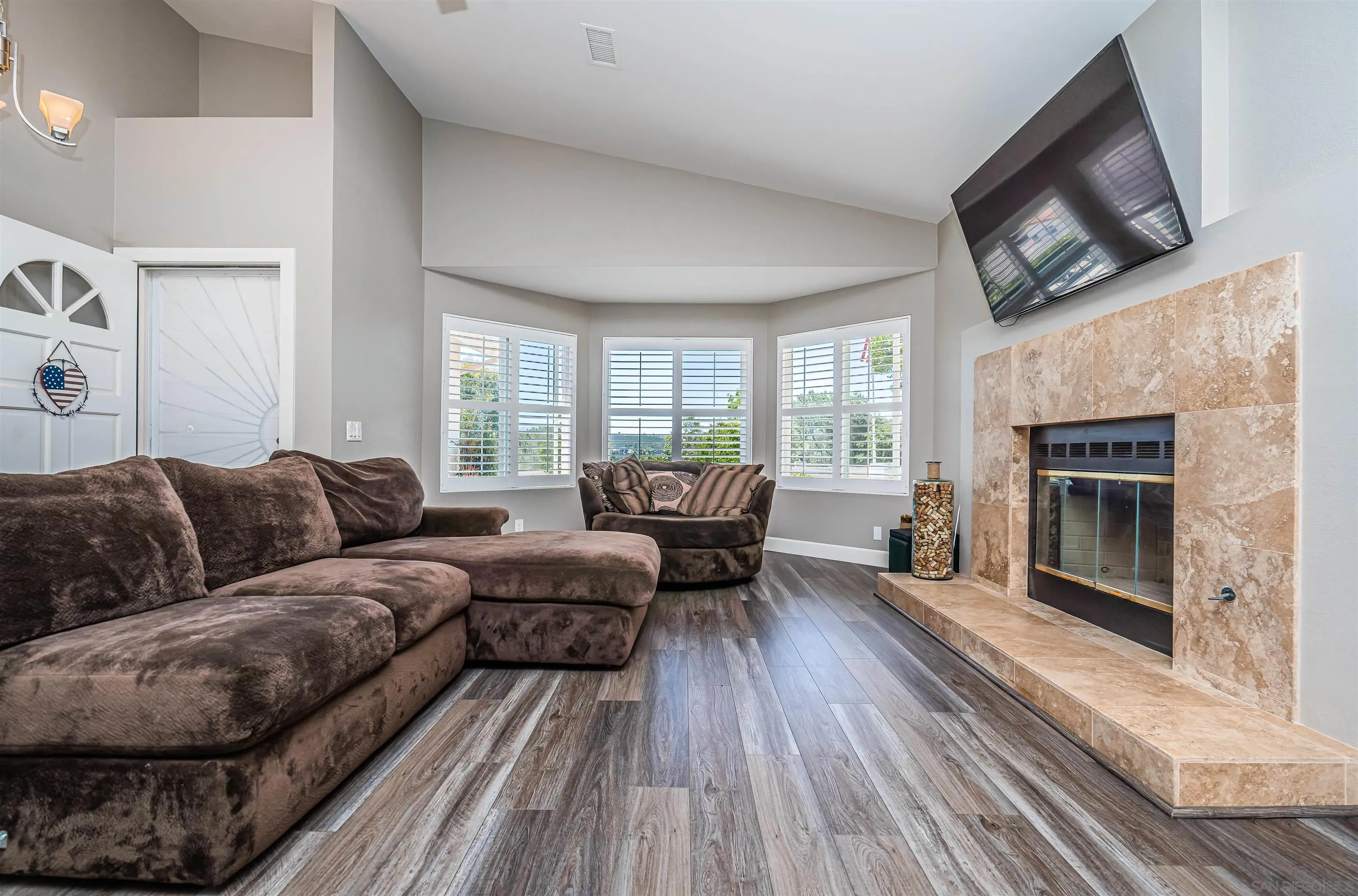 16754 Georgios Way Ramona, CA 92065 - Photo 6 of 29 a living room with furniture and a fireplace