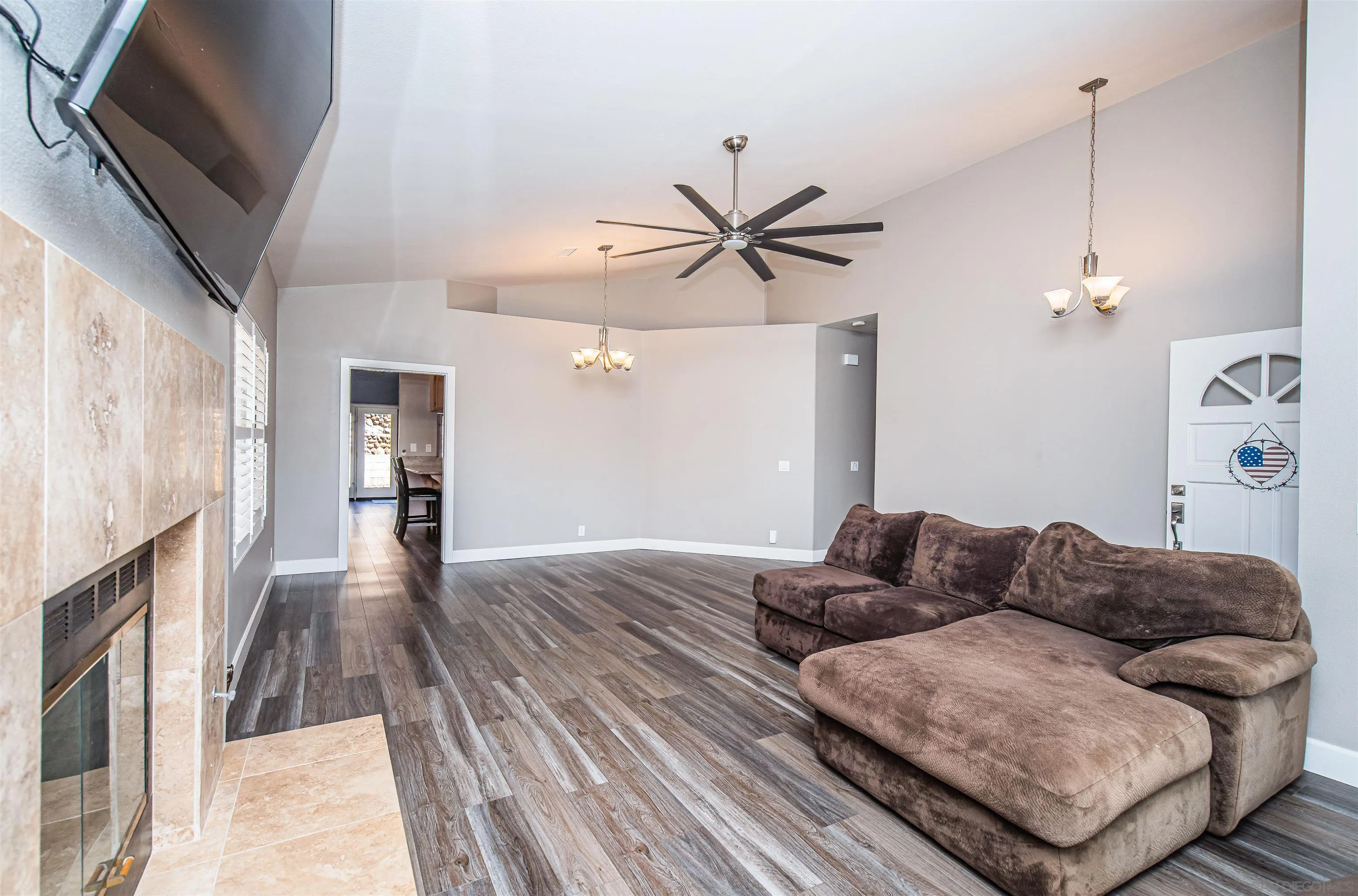 16754 Georgios Way Ramona, CA 92065 - Photo 8 of 29 a living room with furniture and a fireplace